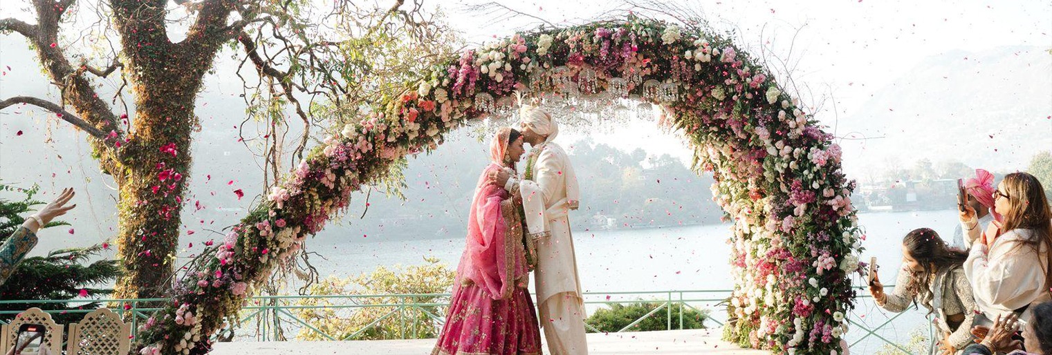 Wedding couple at a riverside resort in Jim Corbett planned by Fair Deal Services